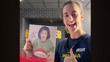 Caitlin Clark autographed a picture of her younger self.