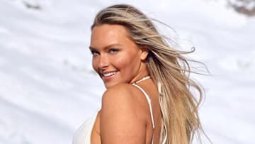 Camille Kostek was photographed by Derek Kettela in Switzerland. Swimsuit by Maliluha. Jacket by Boohoo.