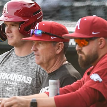 Arkansas Razorbacks coach Dave Van Horn watches from the dugout during a practice.