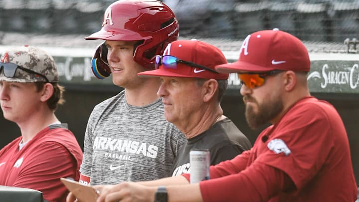 Arkansas Razorbacks coach Dave Van Horn watches from the dugout during a practice.