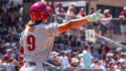 Arkansas Razorbacks' Wehiwa Aloy watches his homer slip in fee away from the foul pole against Texas A&M on Saturday afternoon.