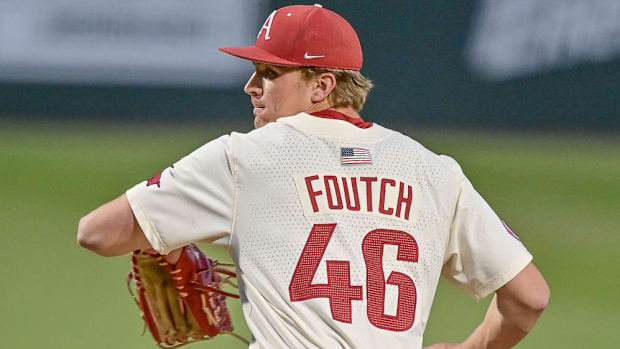 Razorbacks pitcher Christian Foutch winds up to throw a pitch against UCA
