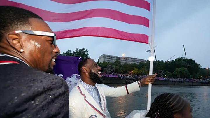 Coco Gauff and LeBron James travel along the Seine River with teammates in Paris, France, during the opening ceremony of the 2024 Summer Olympics.