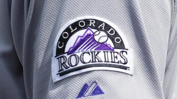 A white jersey sleeve that says "Colorado Rockies" in black and purple on it.