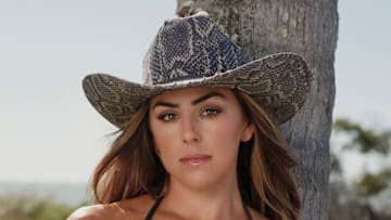 Haley Cavinder was photographed by Katherine Goguen on Captiva Island, Fla. Swimsuit by Lybethras Swimwear. Hay by Zandria. 