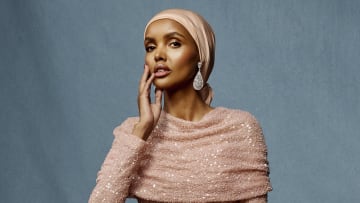 Halima Aden was photographed by Yu Tsai in Hollywood, Fla. Dress by Reem Acra. Shoes by Black Suede Studio. Jewelry by Charlie Lapson.
