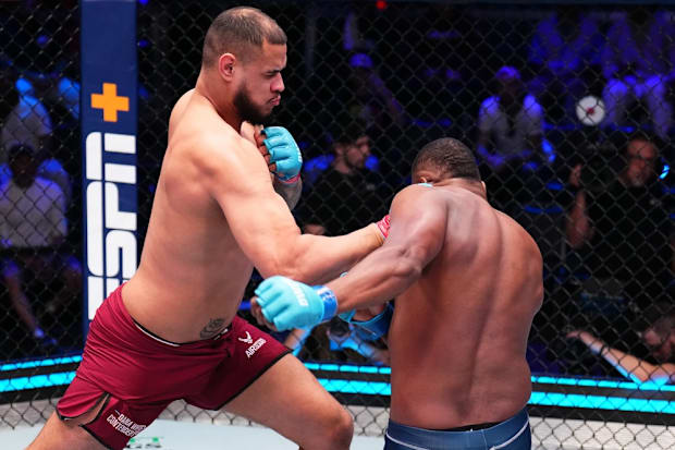 Talisson Teixeira of Brazil punches Arthur Lopes of Brazil in a heavyweight fight during Dana White’s Contender Series.