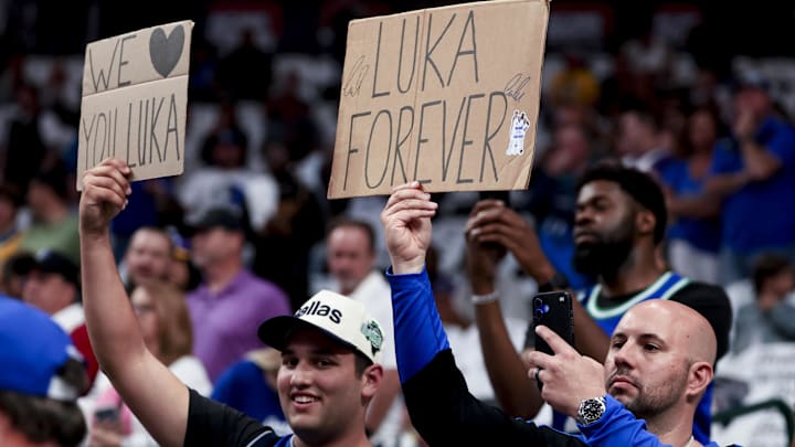 Fans of Los Angeles Lakers guard Doncic hold up signs before the game against the Dallas Mavericks at American Airlines Center. 