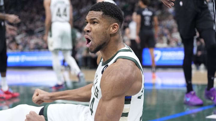Jan 2, 2025; Milwaukee, Wisconsin, USA; Milwaukee Bucks forward Giannis Antetokounmpo (34) reacts after being fouled driving to the basket against the Brooklyn Nets in the first halfat Fiserv Forum. Mandatory Credit: Michael McLoone-Imagn Images
