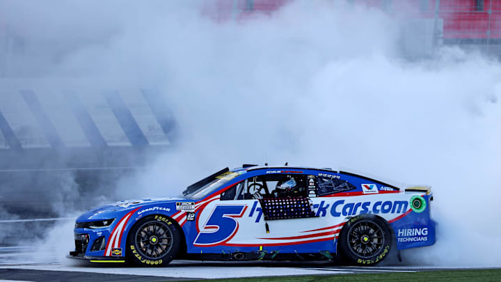 Oct 13, 2024; Concord, North Carolina, USA; NASCAR Cup Series driver Kyle Larson (5) celebrates after winning the Bank of America ROVAL 400 at Charlotte Motor Speedway Road Course. Mandatory Credit: Peter Casey-Imagn Images Oct 13, 2024; Concord, North Carolina, USA; NASCAR Cup Series driver Kyle Larson (5) celebrates after winning the Bank of America ROVAL 400 at Charlotte Motor Speedway Road Course. Mandatory Credit: Peter Casey-Imagn Images