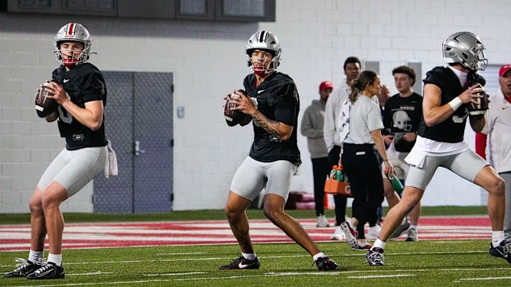Ohio State Buckeyes quarterbacks Julian Sayin (10), Tavien St. Clair (9) and Lincoln Kienholz (3) look to throw during spring football practice at the Woody Hayes Athletic Center on Wednesday, March 19, 2025 in Columbus, Ohio.