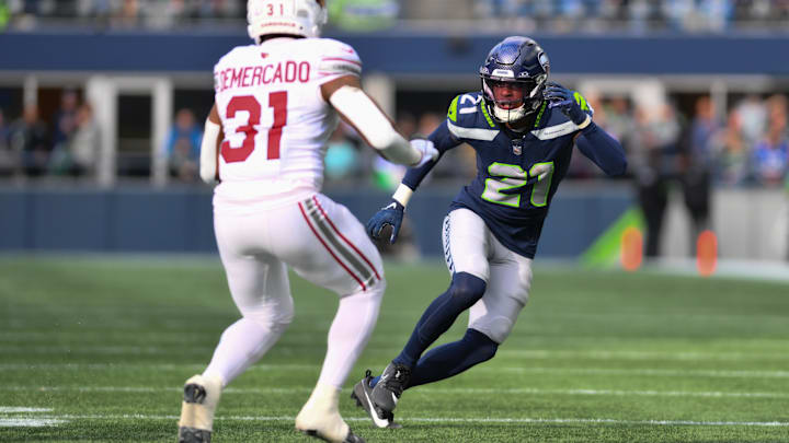 Oct 22, 2023; Seattle, Washington, USA; Seattle Seahawks cornerback Devon Witherspoon (21) covers Arizona Cardinals running back Emari Demercado (31) during the second half at Lumen Field.
