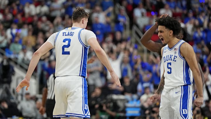 Duke Blue Devils forward Cooper Flagg reacts after scoring a basket with guard Tyrese Proctor.