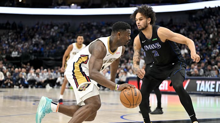 Jan 15, 2024; Dallas, Texas, USA; New Orleans Pelicans forward Zion Williamson (1) drives to the basket past Dallas Mavericks center Dereck Lively II (2) during the second half at the American Airlines Center. Mandatory Credit: Jerome Miron-Imagn Images