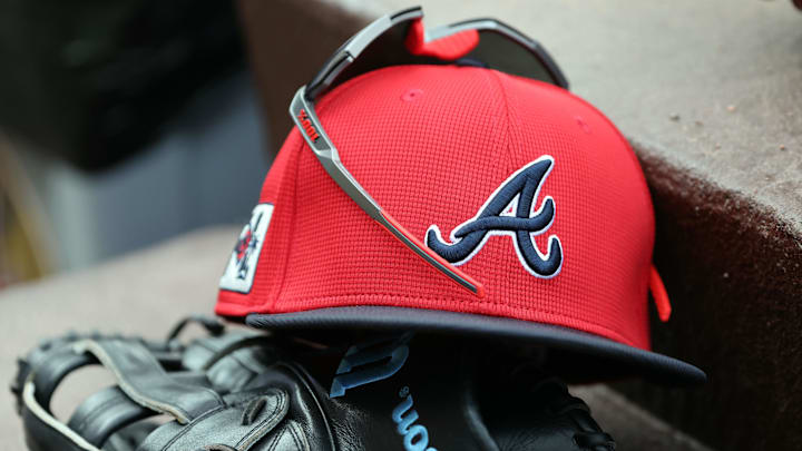 wMar 1, 2025; North Port, Florida, USA; A detail view of Atlanta Braves hat, sunglasses and glove in the dugout during the fifth inning at CoolToday Park. Mandatory Credit: Kim Klement Neitzel-Imagn Images wMar 1, 2025; North Port, Florida, USA; A detail view of Atlanta Braves hat, sunglasses and glove in the dugout during the fifth inning at CoolToday Park. Mandatory Credit: Kim Klement Neitzel-Imagn Images