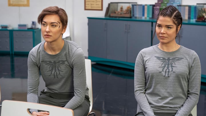 The 100 -- "The Flock" -- Image Number: HUN708b_0538r.jpg -- Pictured (L-R): Tasya Teles as Echo and Marie Avgeropoulos as Octavia -- Photo: Colin Bentley/The CW -- 2020 The CW Network, LLC. All rights reserved.