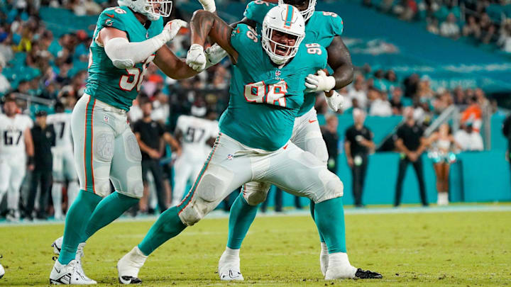 Miami Dolphins defensive tackle Brandon Pili (96) celebrates a tackle for loss during the fourth quarter of a preseason game at Hard Rock Stadium on Friday, August 11, 2023, in Miami Gardens, FL. Miami Dolphins defensive tackle Brandon Pili (96) celebrates a tackle for loss during the fourth quarter of a preseason game at Hard Rock Stadium on Friday, August 11, 2023, in Miami Gardens, FL.