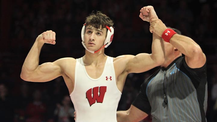Wisconsin's Dean Hamiti flexes after a victory over Iowa's Patrick Kennedy during a dual at the UW Field House on Sunday Jan. 22, 2023.

Uwwrestle Iowa 9 Jan 22 2023