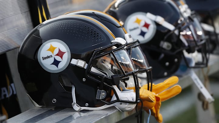 Aug 9, 2024; Pittsburgh, Pennsylvania, USA;  Pittsburgh Steelers helmets on the bench during the game against the Houston Texans during the first quarter at Acrisure Stadium. Mandatory Credit: Charles LeClaire-Imagn Images