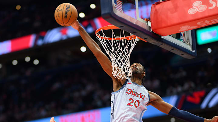 Mar 31, 2025; Washington, District of Columbia, USA; Washington Wizards forward Alex Sarr (20) blocks a shot during the first quarter against the Miami Heat at Capital One Arena. Mandatory Credit: Reggie Hildred-Imagn Images
