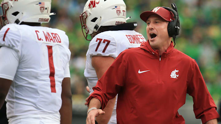 Washington State coach Jake Dickert celebrates with his team during the second quarter against Oregon at Autzen Stadium Saturday, Oct. 21, 2023.
