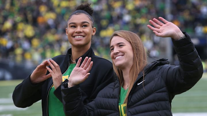 Former Oregon women's basketball players Satou Sabally, left, and Sabrina Ionescu are introduced during the Oregon Colorado Saturday Oct. 30, 2021.Eug 103021 Uo Cofb10