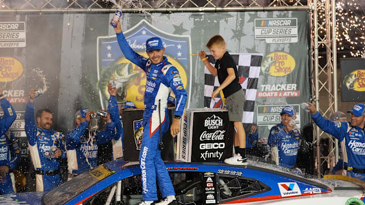 Sep 21, 2024; Bristol, Tennessee, USA; NASCAR Cup Series driver Kyle Larson (5) and his son Owen after winning the Bass Pro Shops Night Race at Bristol Motor Speedway. Sep 21, 2024; Bristol, Tennessee, USA; NASCAR Cup Series driver Kyle Larson (5) and his son Owen after winning the Bass Pro Shops Night Race at Bristol Motor Speedway.