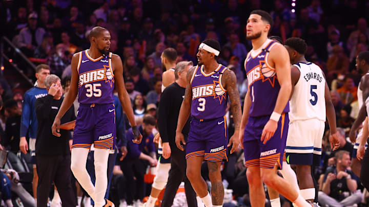 Jan 29, 2025; Phoenix, Arizona, USA; Phoenix Suns forward Kevin Durant (35) with guard Bradley Beal (3) and Devin Booker (1) against the Minnesota Timberwolves at Footprint Center. Mandatory Credit: Mark J. Rebilas-Imagn Images