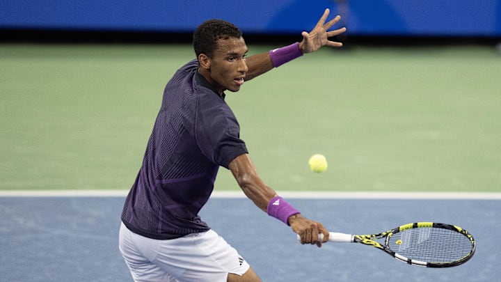 Aug 16, 2024; Cincinnati, OH, USA; Felix Auger-Aliassime of Canada returns a shot during his match against Jack Draper of Great Britain on day six of the Cincinnati Open. Mandatory Credit: Susan Mullane-Imagn Images