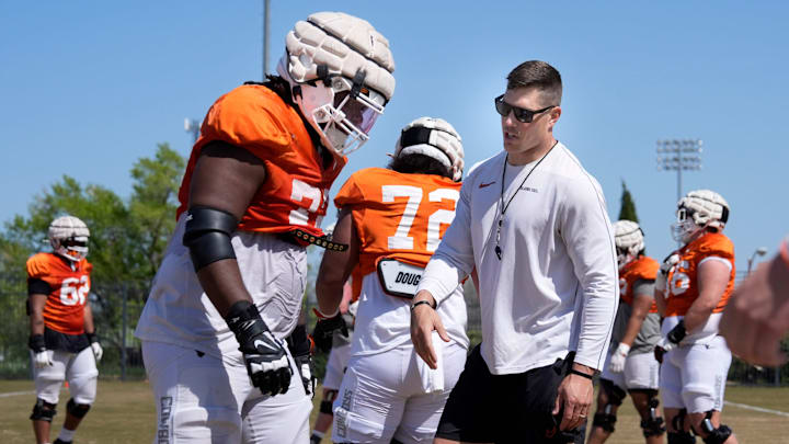 Oklahoma State offensive lineman coach Cooper Bassett talks with during a Spring football practice at Oklahoma State University in Stillwater, Okla., Tuesday, April, 8, 2025.