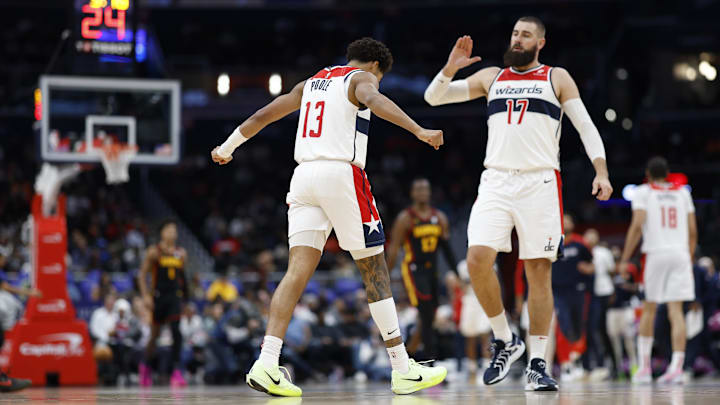 Oct 30, 2024; Washington, District of Columbia, USA; Washington Wizards guard Jordan Poole (13) celebrates with Wizards center Jonas Valanciunas (17) against the Atlanta Hawks in the first half at Capital One Arena. Mandatory Credit: Geoff Burke-Imagn Images