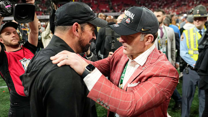 Ohio State Buckeyes head coach Ryan Day gets a hug from athletic director Ross Bjork following the 34-23 win over the Notre Dame Fighting Irish to win the College Football Playoff National Championship at Mercedes-Benz Stadium in Atlanta on Jan. 21, 2025. Ohio State Buckeyes head coach Ryan Day gets a hug from athletic director Ross Bjork following the 34-23 win over the Notre Dame Fighting Irish to win the College Football Playoff National Championship at Mercedes-Benz Stadium in Atlanta on Jan. 21, 2025.