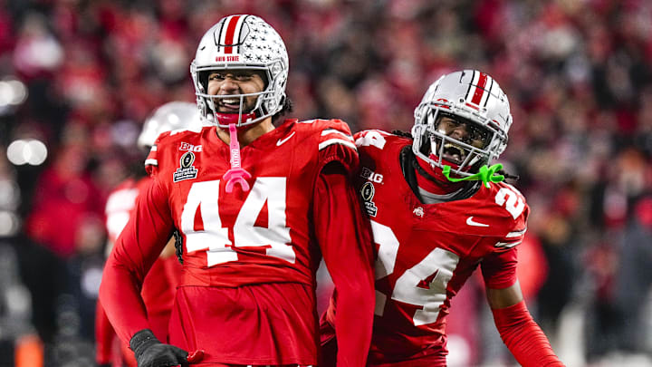 Ohio State Buckeyes defensive end JT Tuimoloau (44) and cornerback Jermaine Mathews Jr. (24) celebrate against the Tennessee Volunteers in the second half at Ohio Stadium.