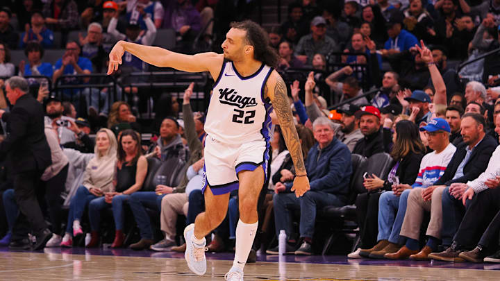 Mar 19, 2025; Sacramento, California, USA; Sacramento Kings guard Devin Carter (22) gestures after a three point basket against the Cleveland Cavaliers during the third quarter at Golden 1 Center. Mandatory Credit: Kelley L Cox-Imagn Images