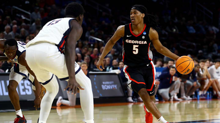 Mar 20, 2025; Wichita, KS, USA; Georgia Bulldogs guard Silas Demary Jr. (5) dribbles against Gonzaga Bulldogs forward Graham Ike (13) in the second half of a first round men’s NCAA Tournament game at Intrust Bank Arena. Mandatory Credit: Nick Tre. Smith-Imagn Images Mar 20, 2025; Wichita, KS, USA; Georgia Bulldogs guard Silas Demary Jr. (5) dribbles against Gonzaga Bulldogs forward Graham Ike (13) in the second half of a first round men’s NCAA Tournament game at Intrust Bank Arena. Mandatory Credit: Nick Tre. Smith-Imagn Images