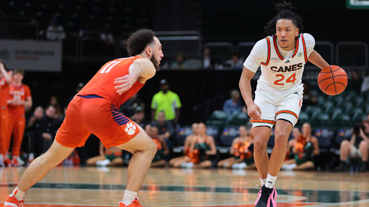 Dec 7, 2024; Coral Gables, Florida, USA; Miami Hurricanes guard Nijel Pack (24) dribbles the basketball as Clemson Tigers guard Jaeden Zackery (11) defends during the second half at Watsco Center. Mandatory Credit: Sam Navarro-Imagn Images Dec 7, 2024; Coral Gables, Florida, USA; Miami Hurricanes guard Nijel Pack (24) dribbles the basketball as Clemson Tigers guard Jaeden Zackery (11) defends during the second half at Watsco Center. Mandatory Credit: Sam Navarro-Imagn Images