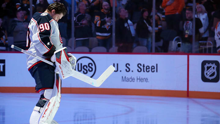 Jan 7, 2025; Pittsburgh, Pennsylvania, USA; Columbus Blue Jackets goaltender Elvis Merzlikins (90) stands for the national anthem before playing against the Pittsburgh Penguins at PPG Paints Arena. Mandatory Credit: Charles LeClaire-Imagn Images