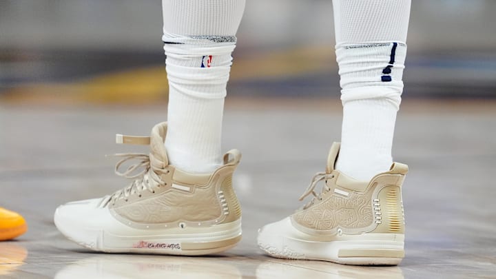 Nov 2, 2024; Denver, Colorado, USA; Detailed view of the shoes worn by Denver Nuggets center Nikola Jokic (15) during the first half against the Utah Jazz at Ball Arena. Mandatory Credit: Ron Chenoy-Imagn Images