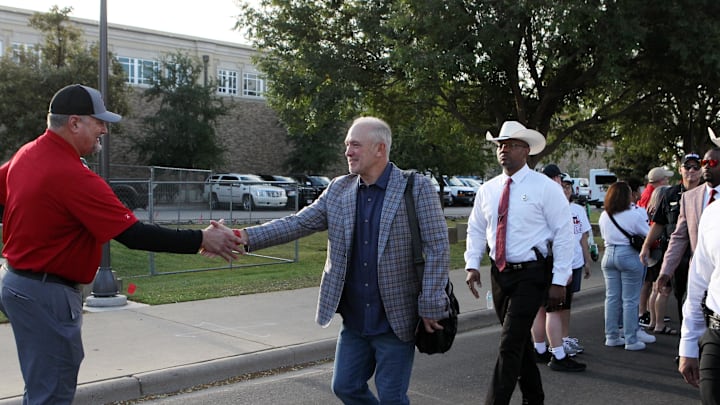 Sep 14, 2024; Lubbock, Texas, USA; Texas Tech Red Raiders head coach Joey McGuire greets fans outside the stadium before a game against the North Texas Mean Green at Jones AT&T Stadium and Cody Campbell Field. Mandatory Credit: Michael C. Johnson-Imagn Images
