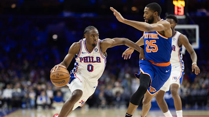 Jan 15, 2025; Philadelphia, Pennsylvania, USA; Philadelphia 76ers guard Tyrese Maxey (0) drives against New York Knicks forward Mikal Bridges (25) during the third quarter at Wells Fargo Center. Mandatory Credit: Bill Streicher-Imagn Images Jan 15, 2025; Philadelphia, Pennsylvania, USA; Philadelphia 76ers guard Tyrese Maxey (0) drives against New York Knicks forward Mikal Bridges (25) during the third quarter at Wells Fargo Center. Mandatory Credit: Bill Streicher-Imagn Images