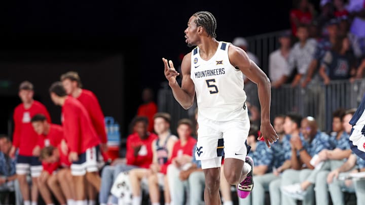 Nov 29, 2024; Paradise Island, Bahamas, BHS;  West Virginia Mountaineers guard Toby Okani (5) reacts after scoring against the Arizona Wildcats during the first half at Imperial Arena at the Atlantis resort.  Mandatory Credit: Kevin Jairaj-Imagn Images