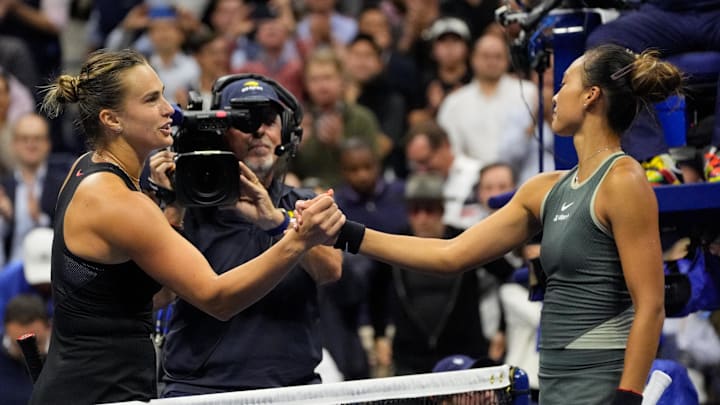 Sept 3, 2024; Flushing, NY, USA;  Aryna Sabalenka (left) after beating Qinwen Zheng (CHN) on day nine of the 2024 U.S. Open tennis tournament at USTA Billie Jean King National Tennis Center. Mandatory Credit: Robert Deutsch-Imagn Images