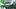 Illustration of Spider-Man villain Tombstone on green background with sneer, close-up of his blue and white face with detail. Illustration of Spider-Man villain Tombstone on green background with sneer, close-up of his blue and white face with detail.