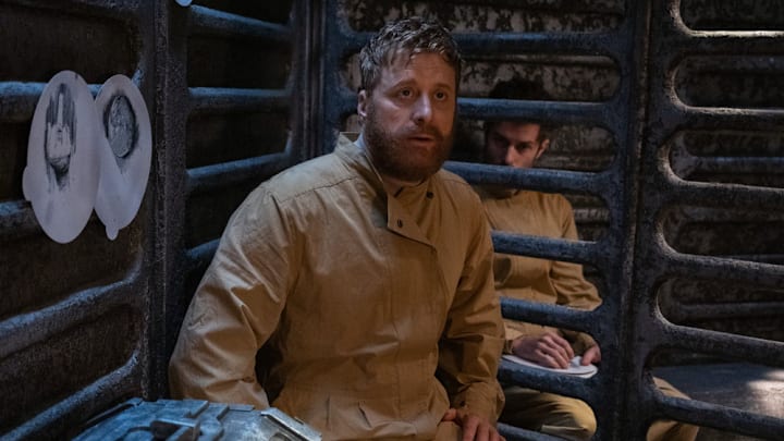 RESIDENT ALIEN -- "Prisoners" Episode 401 -- Pictured: (l-r) Alan Tudyk as Harry Vanderspeigle, Paul Piaskowski as Robert -- (Photo by: James Dittiger/USA Network)