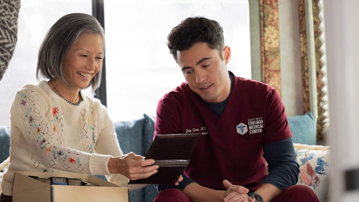 CHICAGO MED -- "Twist & Shout" Episode 1113 -- Pictured: (l-r) Tamlyn Tomita as Celeste Frost, Darren Barnet as Dr. John Frost -- 