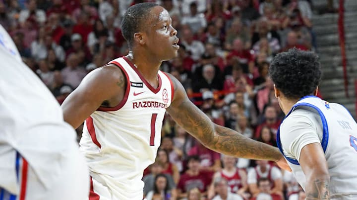 Arkansas Razorbacks guard Johnell Davis looks for the ball in exhibition game against the Kansas Jayhawks at Bud Walton Arena in Fayetteville, Ark.