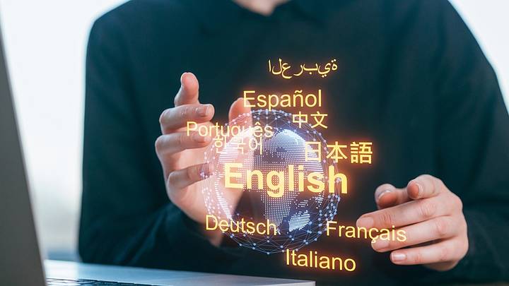 Person at laptop swiping through language options Person at laptop swiping through language options