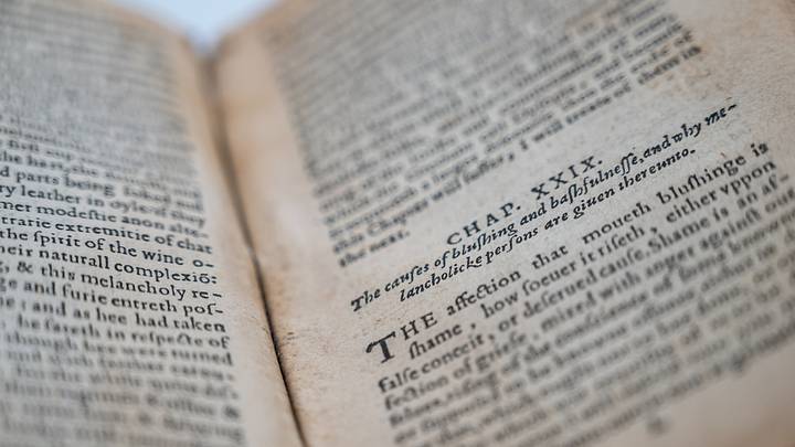 Book open to ancient English words Book open to ancient English words