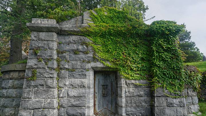 An ivy-covered stone crypt in the Sleepy Hollow Cemetery. An ivy-covered stone crypt in the Sleepy Hollow Cemetery.
