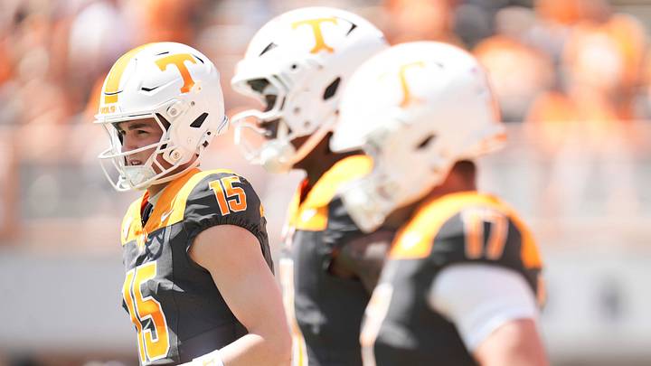 Tennessee quarterbacks including George MacIntyre (15), Faizon Brandon (11), and Ryan Staub (17), warm up before the Orange and White game at Neyland Stadium in Knoxville, Tennessee, April 11, 2026.